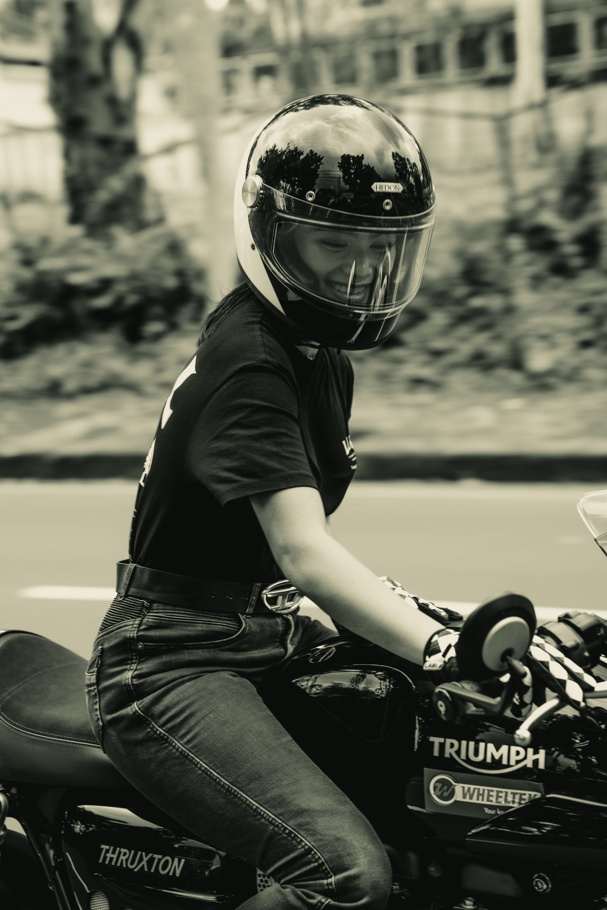 Rider in white gear on a green hillside