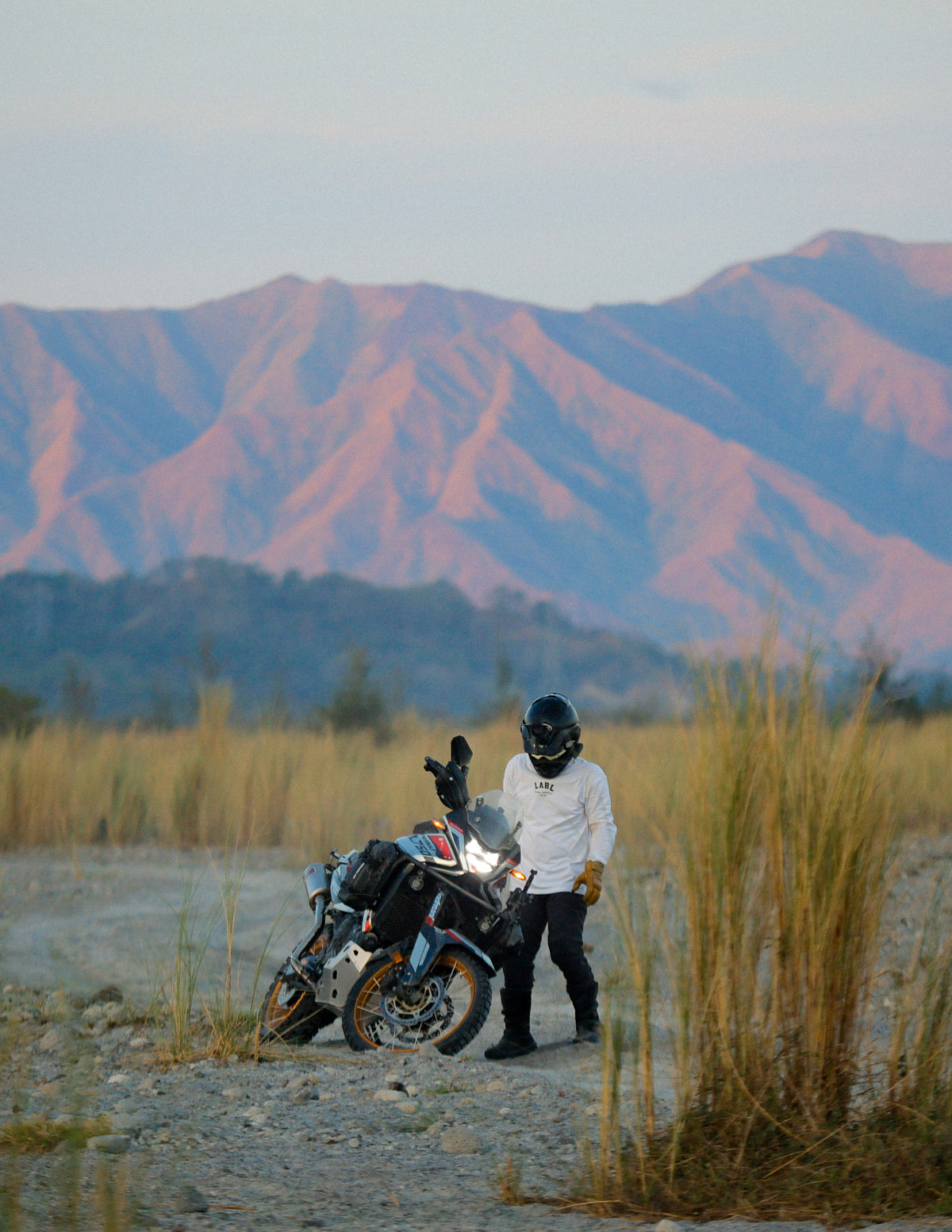 Rider above the clouds on a mountain road